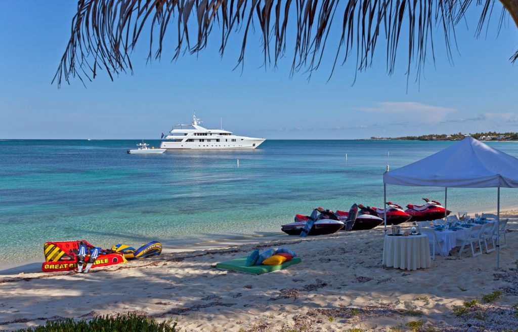 exclusive yacht charter dining on the beach